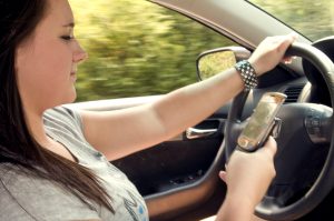 teen-girl-texting-while-driving-or